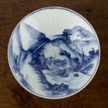 Blue and white porcelain bowl Chinese painted with a river landscape and bridge, four character