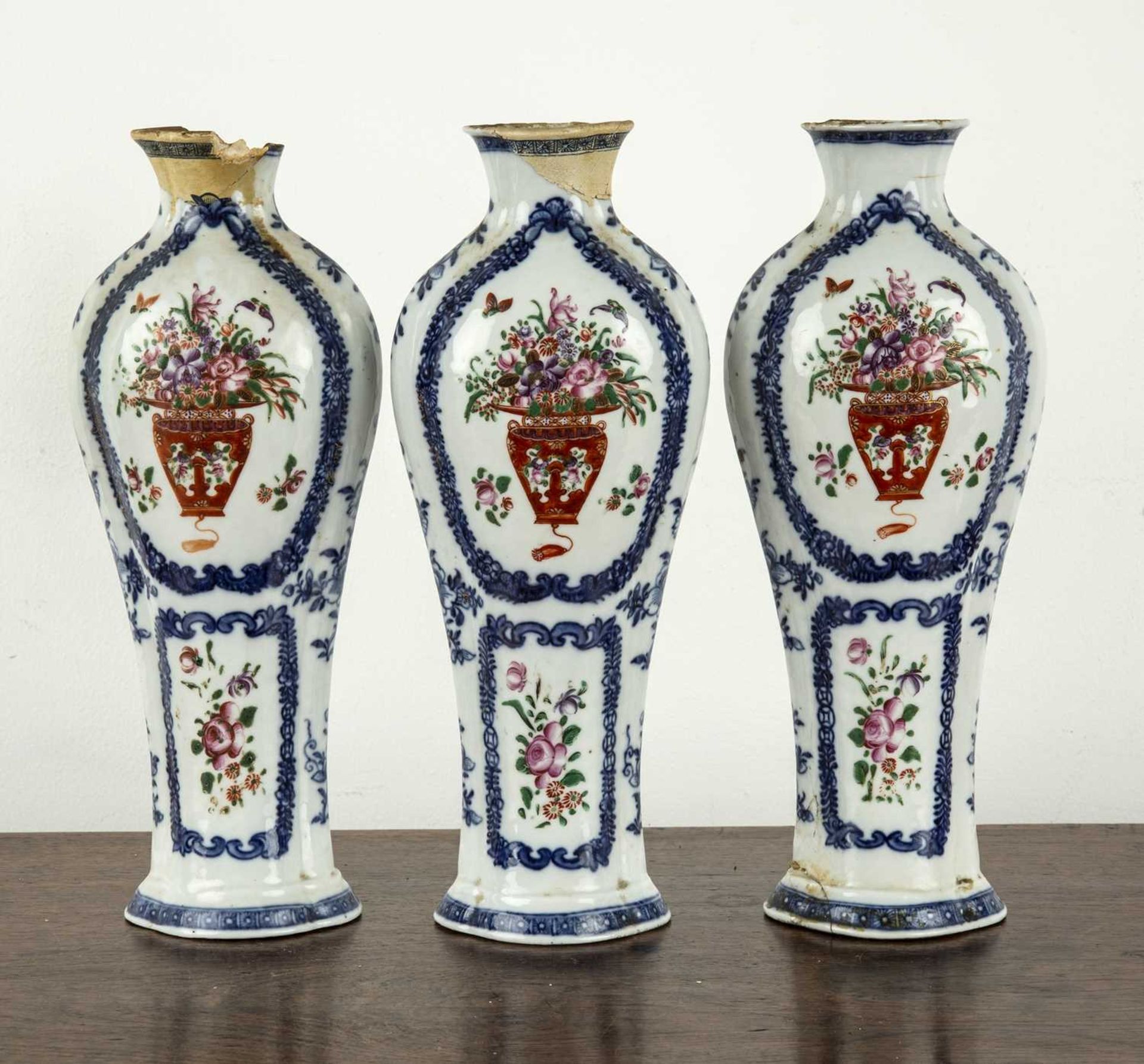 Three piece garniture of famille rose vases Chinese, late 18th Century painted with vases of - Image 2 of 4