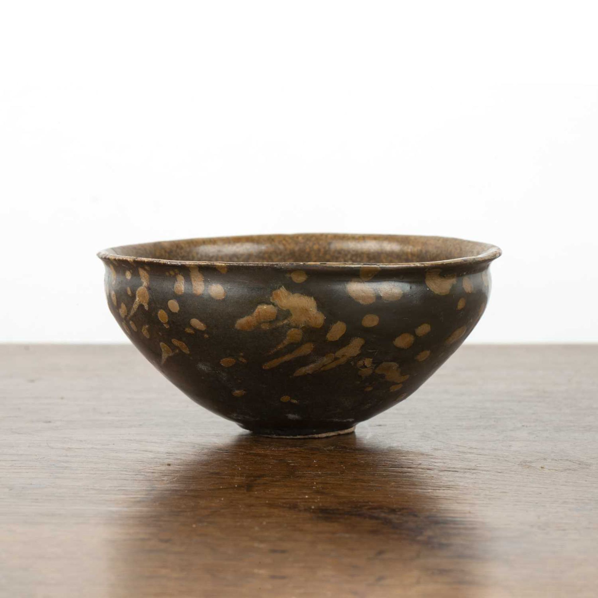 Jizhou tea bowl Southern Song, 12th/13th Century decorated with a wax resist design of a flowering