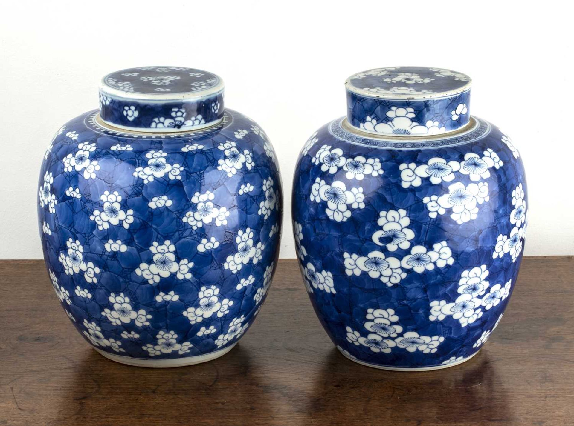 Two similar blue and white ginger jars and covers Chinese, 18th/19th Century each painted with