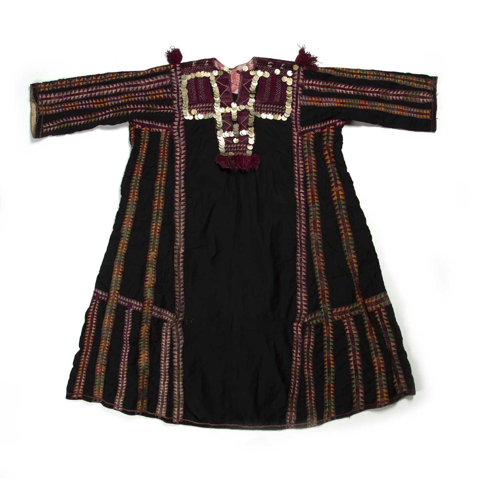Black ground dress Palestinian with geometric embroidered borders in yellow, green and purple,
