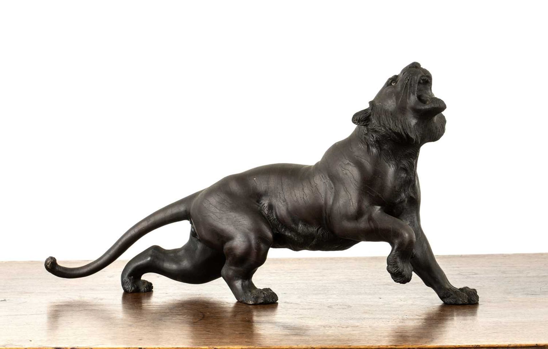 Bronze model of a snarling tiger Japanese, Meiji period the animal with its head raised, signed,
