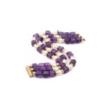 An amethyst and cultured pearl matched necklace and bracelet suite, comprising a triple strand