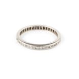 A diamond full hoop eternity ring, channel set throughout with single-cut diamonds, white precious