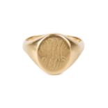 An 18ct gold signet ring, the oval panel with engraved monogram, hallmarked for London 1956, ring