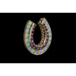 A Victorian ruby and opal horseshoe brooch, inset with rows of graduated cushion-shaped mixed-cut