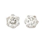 A pair of diamond single stone ear studs, each round brilliant-cut diamond in claw setting, on