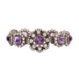 An amethyst set panel bracelet, designed as a line of articulated cushion-shaped amethyst and