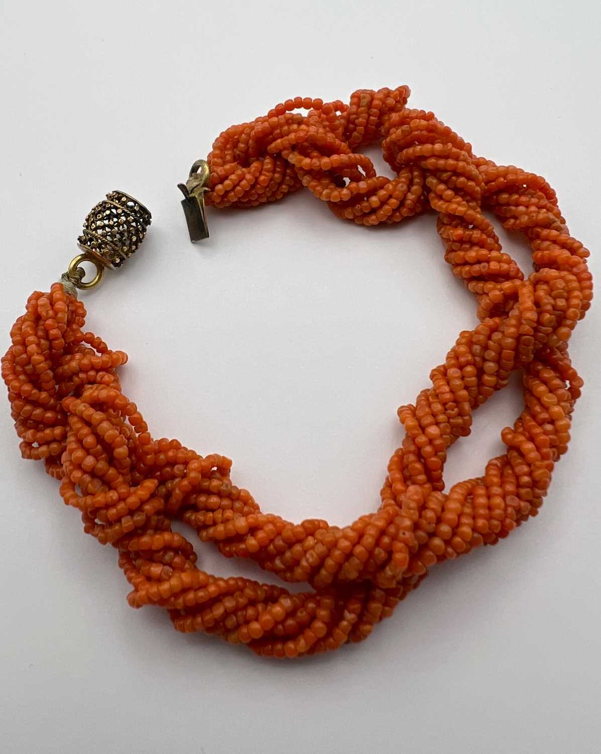 A coral bead torsade necklace and bracelet suite, designed as twisted multi-strands of coral - Image 6 of 7