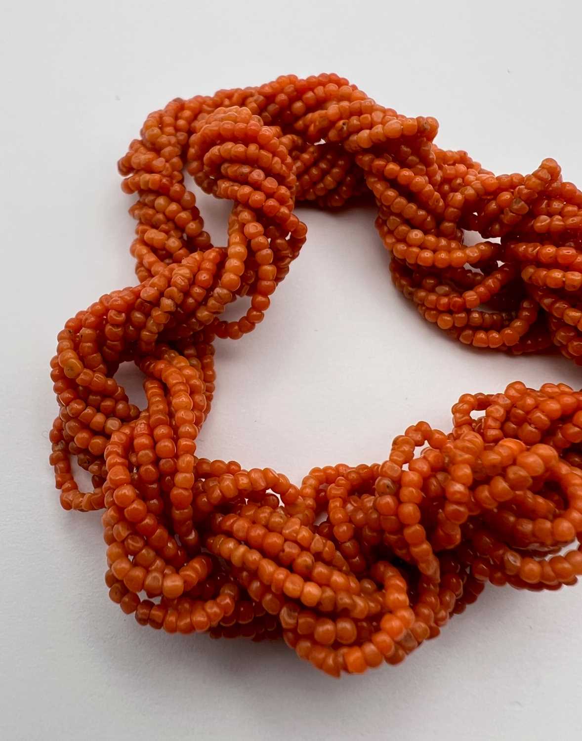 A coral bead torsade necklace and bracelet suite, designed as twisted multi-strands of coral - Image 7 of 7