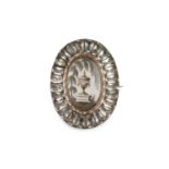 A late 18th/early 19th century ivory and paste memorial jewel, the oval ivory panel painted to