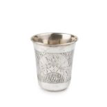 A late 19th century Russian silver beaker, of slightly tapered form, engraved with two shaped