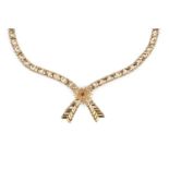 A 9ct gold collar necklace, designed as a tapered crossover ribbon, with chevron detail and red