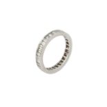 A diamond full hoop eternity ring, channel set throughout with baguette-cut diamonds, white precious
