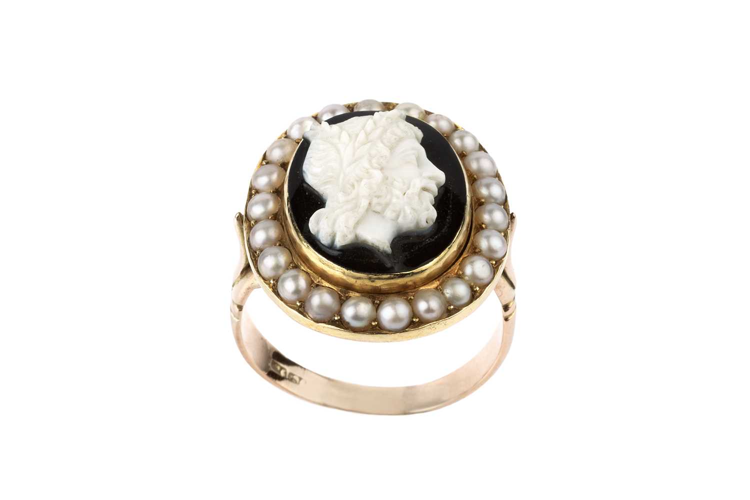 A cameo and half pearl cluster ring, the oval hardstone cameo carved to depict a classical male