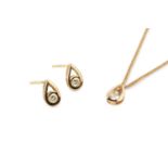 A diamond pendant necklace and ear studs suite, of teardrop design, collet set with round