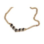 A sapphire and diamond set necklace, of wishbone design, 9ct gold mounted, and a double curb-link