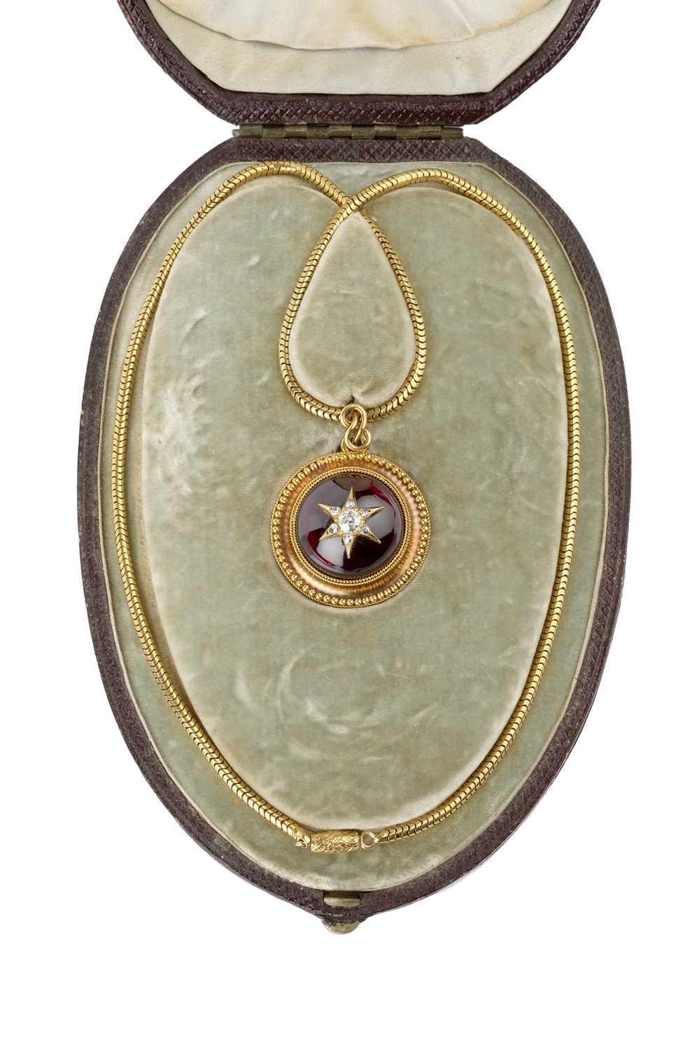 A Victorian garnet and diamond locket pendant on chain, the circular pendant centred with a cabochon - Image 2 of 5