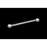 A cultured pearl and diamond bar brooch, the millegrained bar of uniform old-cut diamonds