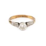 A diamond single stone ring, the round brilliant-cut diamond claw set between millegrain set