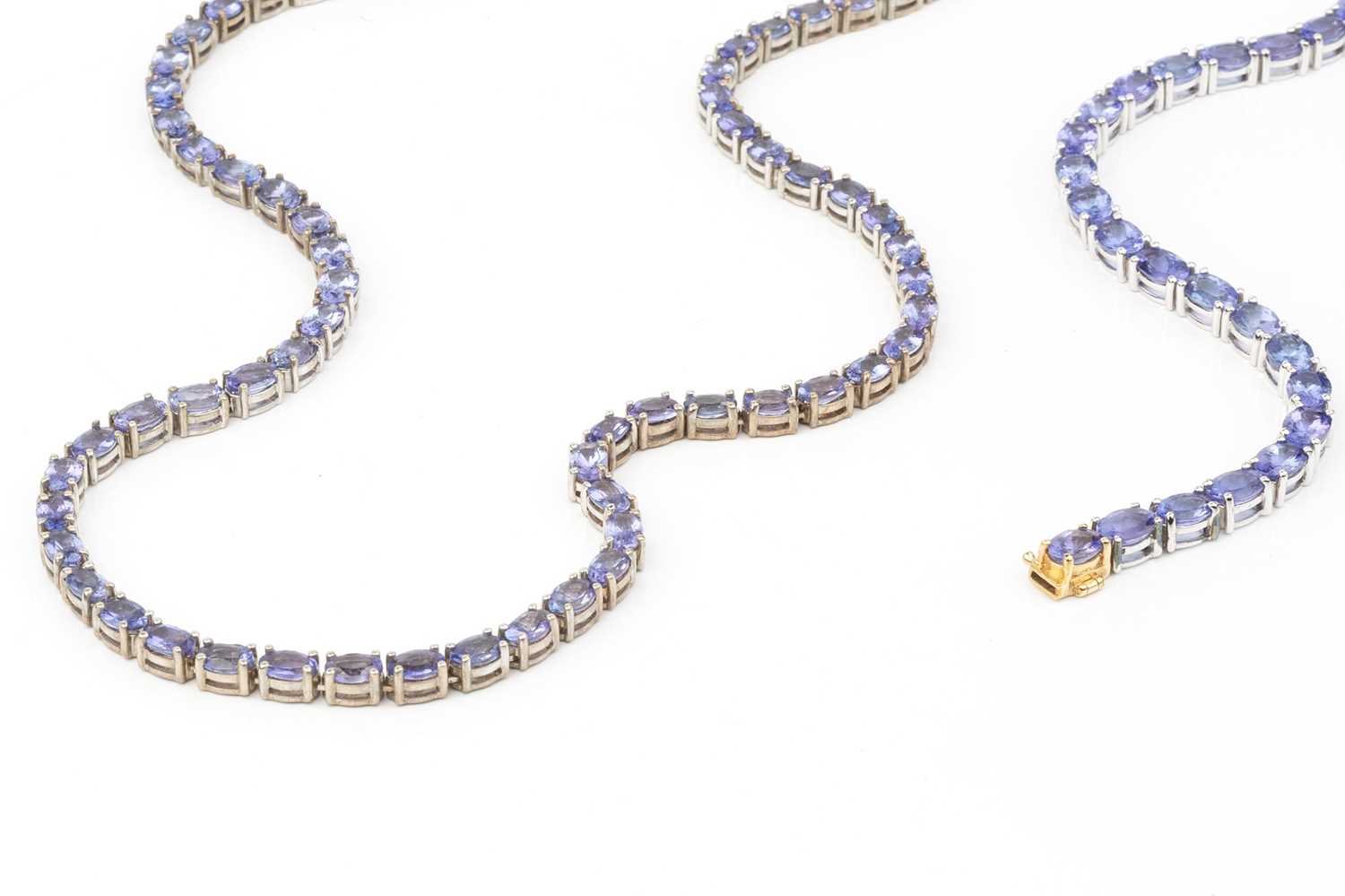 A collection of tanzanite jewellery, comprising a necklace and bracelet suite, each with a line of - Image 4 of 8