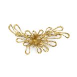 An 18ct gold panel brooch, designed as an abstract openwork spray, with London import marks,