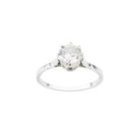 A diamond single stone ring, the round brilliant-cut diamond in claw setting, white precious metal