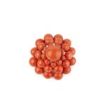A coral panel brooch, designed as a tiered cluster of coral corallium rubrum beads, together with