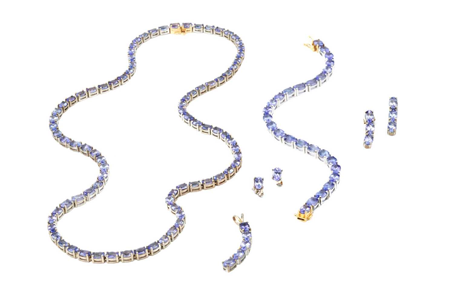 A collection of tanzanite jewellery, comprising a necklace and bracelet suite, each with a line of - Image 2 of 8