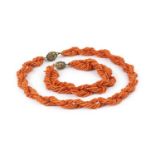 A coral bead torsade necklace and bracelet suite, designed as twisted multi-strands of coral