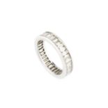 A diamond full hoop eternity ring, channel set throughout with baguette-cut diamonds, white precious