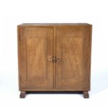 Cotswold School Arts and Crafts cupboard oak, with panelled doors and sled feet 80cm high, 80cm