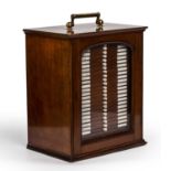 A Victorian mahogany microscope specimen slide case with a lacquered brass carrying handle, a glazed