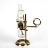 A 19th century brass microscope oil lamp by J. Swift & Son 13cm wide 30cm highceramic shade cracked,