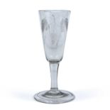 An 18th century ale glass with engraved decoration circa 1760, the foot 7.5cm diameter 15cm highGood
