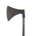 A 17th century French or Polish Iron forged executioners axe head 27cm x 25cm on a later pole.