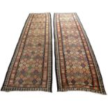 A near pair of antique polychrome Kilim rugs both approximately 100cm x 360cmWear to ends and