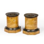 A pair of 19th century French Toleware cylindrical plinths with marble effect paint and octagonal