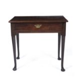 A George III mahogany side table with a single frieze drawer, brass swan neck handle, turned