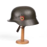 A German World War II SS helmet stamped '22163', transfer printed '792'In good condition, with minor