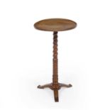 A 19th century fruitwood occasional table with a spiral turned stem and triform base, 38cm
