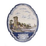 A 19th century Dutch Delft polychrome wall plaque decorated with a coastal river scene, shepherds