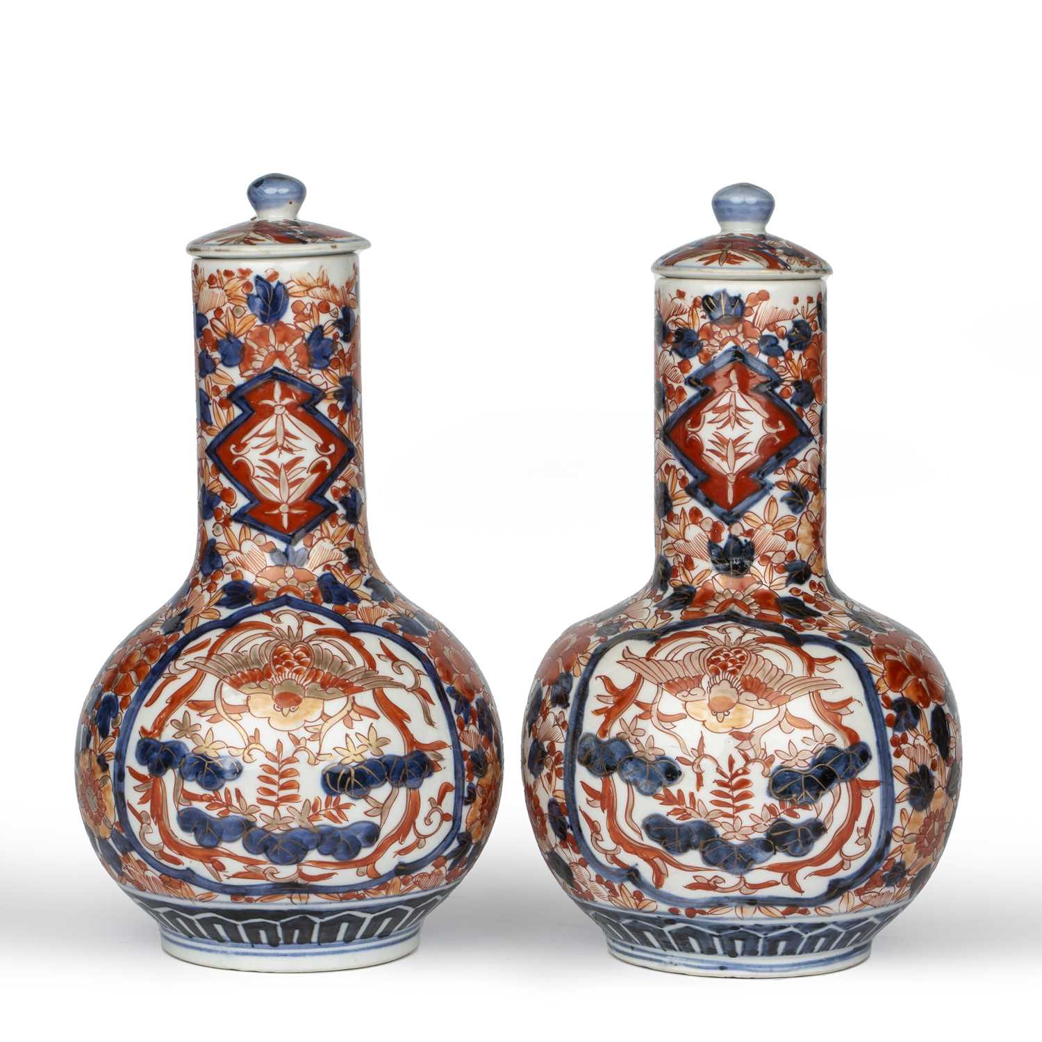 A pair of late 19th century Japanese Imari bottle vases with covers, 15cm wide 27cm high.Good, minor - Image 2 of 4