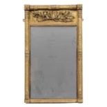 A Regency gilded gesso pier glass the frieze decorated with oak leaves above a bevelled glass panel,