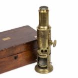 A mid 19th century drum microscope, unsigned, with six objectives, four slides and original fitted