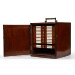 A Victorian mahogany microscope slide case with 14 drawers (5 missing) and approximatley 100