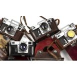 Four Kiev Rangefinder cameras all with lens and leather cases.