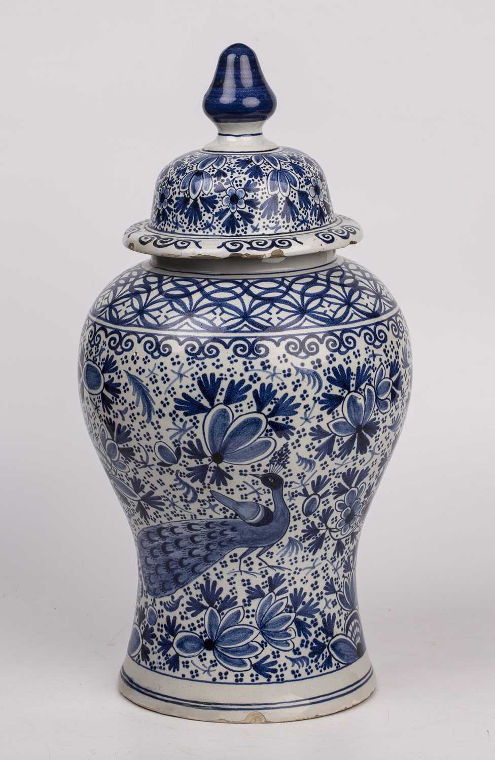 A 19th century Dutch Delft blue and white vase and cover of baluster form with foliate and peacock - Image 2 of 4