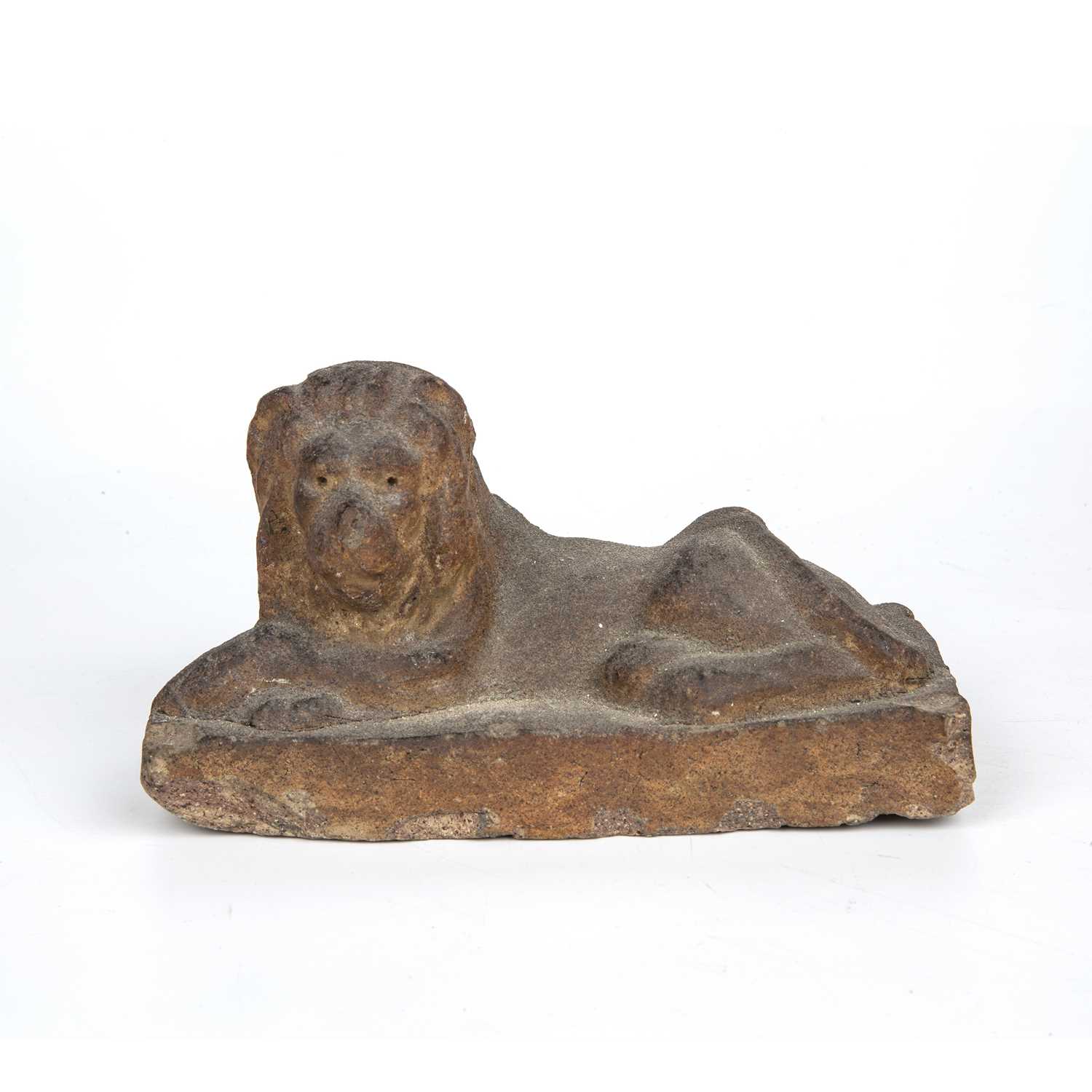 An early 19th century stoneware recumbent lion 17cm wide x 8cm deep x 9.5cm highChip to one