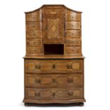 A late 18th / early 19th century German serpentine parquetry chest with eleven short drawers
